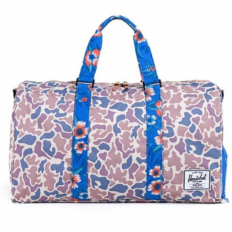 Herschel Supply Co. Novel Bag|Duck Camo/ Paradise|Buffalo Plaid|Desert Camo|Apple Polka Dot|Woodland Camo|Black Checkerboard|Black/ Tan|Grey/ Tan|Navy/ Tan|Speckle|Black Polka Dot|Peacoat Offset|Carrot/ Navy|Rust/ Tan|Army|One size fits all|N/A